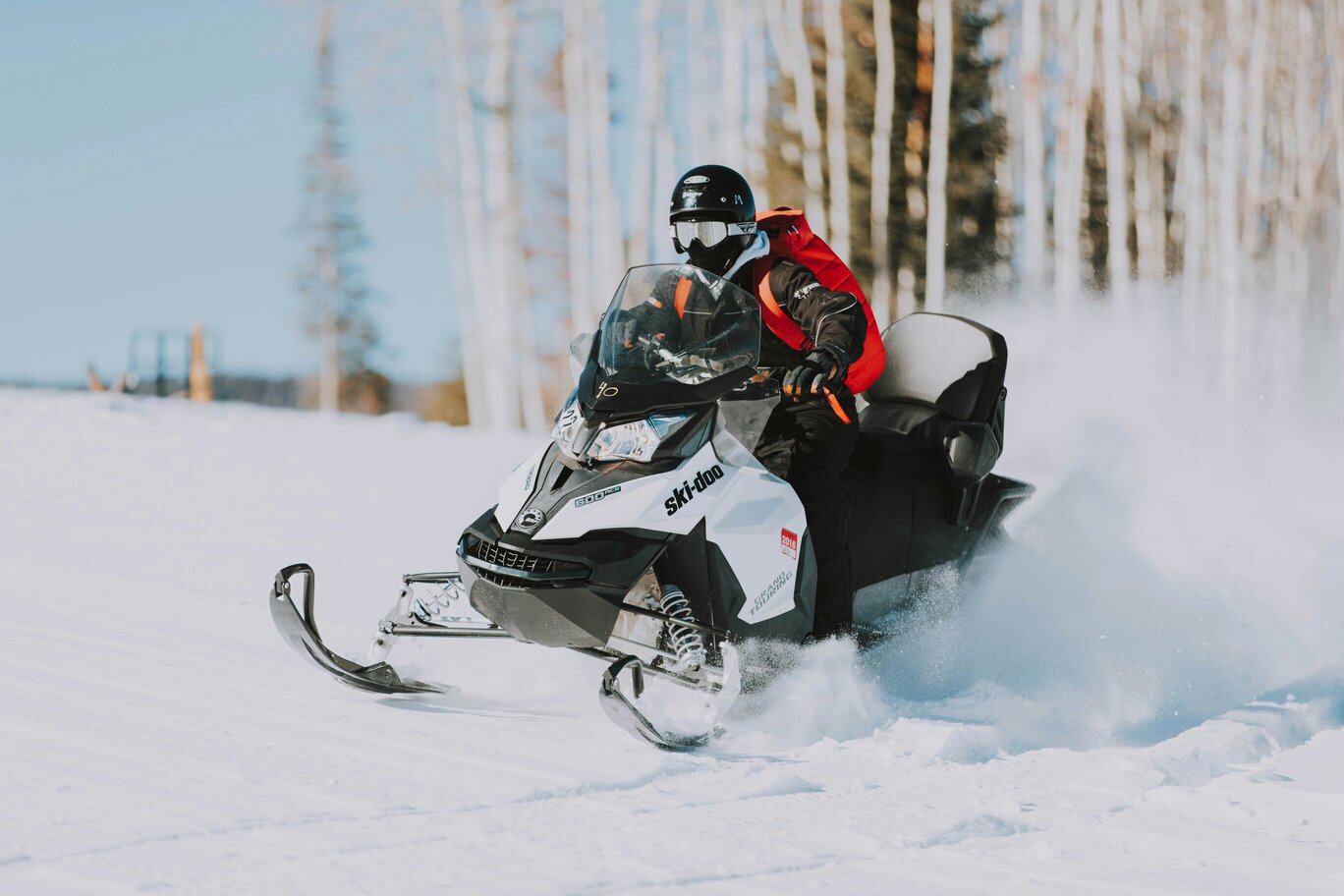 Snowmobile operating in a winter powersports environment